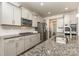 Modern kitchen with granite countertops and stainless steel appliances at 9727 White Chapel Nw Dr, Concord, NC 28027