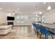 Open living area has fireplace, backyard views, and a breakfast bar with pendant lighting at 9727 White Chapel Nw Dr, Concord, NC 28027