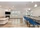 Bright, open living area featuring a fireplace, hardwood floors, and modern lighting at 9727 White Chapel Nw Dr, Concord, NC 28027
