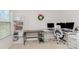 Well-lit office with desk space, storage, and multiple monitors at 9727 White Chapel Nw Dr, Concord, NC 28027