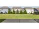Spacious backyard featuring a large lawn and mature landscaping, perfect for outdoor activities and relaxation at 1005 Argentium Way, Waxhaw, NC 28173