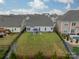 Spacious fenced backyard featuring a patio, lush lawn, and views of the neighborhood at 1005 Argentium Way, Waxhaw, NC 28173