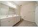 This bathroom features dual sinks and vanities and tile floors at 1005 Argentium Way, Waxhaw, NC 28173