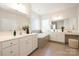 Bright primary bathroom with double sinks, vanity, and tiled tub and shower combo at 1005 Argentium Way, Waxhaw, NC 28173