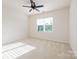 Bedroom with a ceiling fan, carpet flooring, and a bright window at 1005 Argentium Way, Waxhaw, NC 28173