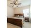 Bedroom features a large bed, nightstand, and ceiling fan at 1005 Argentium Way, Waxhaw, NC 28173