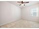 Bedroom with a ceiling fan, carpet flooring, and bright window at 1005 Argentium Way, Waxhaw, NC 28173