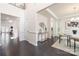 Open foyer featuring dark wood floors, and trim, flowing to dining and living spaces at 1005 Argentium Way, Waxhaw, NC 28173