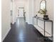 Hallway with hardwood floors and a view of the front door at 1005 Argentium Way, Waxhaw, NC 28173