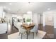 Spacious kitchen with stainless steel appliances, granite counters and an open dining area at 1005 Argentium Way, Waxhaw, NC 28173