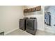 Modern laundry room equipped with new front-loading washer and dryer at 1005 Argentium Way, Waxhaw, NC 28173
