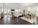 Inviting living room with fireplace, large windows, and open-concept dining area at 1005 Argentium Way, Waxhaw, NC 28173