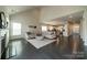 Spacious living room with high ceilings, a cozy fireplace, and an open flow into the kitchen at 1005 Argentium Way, Waxhaw, NC 28173