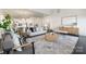 Open floor plan features a living room with bright natural light, and view of the kitchen at 1005 Argentium Way, Waxhaw, NC 28173