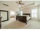 Spacious main bedroom features a tray ceiling and access to the ensuite bath with large soaking tub at 1005 Argentium Way, Waxhaw, NC 28173