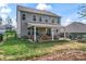 Spacious backyard showcasing a covered patio with outdoor seating and a built-in grill perfect for entertaining at 10072 Fox Trotter Ln, Midland, NC 28107