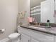 Well-maintained bathroom with granite countertops, a neutral color scheme, and a bathtub with a shower curtain at 10072 Fox Trotter Ln, Midland, NC 28107