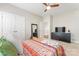 Comfortable bedroom with carpet, featuring a ceiling fan and ample closet space for storage and organization at 10072 Fox Trotter Ln, Midland, NC 28107