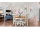 Cozy dining area with hardwood floors and modern finishes that seamlessly connects to the adjacent living space at 10072 Fox Trotter Ln, Midland, NC 28107