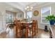 Formal dining room boasts wood flooring, detailed trim and crown molding, and natural light at 10072 Fox Trotter Ln, Midland, NC 28107