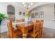 Inviting dining room featuring a wooden table, archway access, and neutral wall colors with stylish decorations at 10072 Fox Trotter Ln, Midland, NC 28107