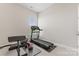 Dedicated exercise room with modern workout equipment including a treadmill, weights, and exercise bench at 10072 Fox Trotter Ln, Midland, NC 28107