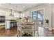 Cozy breakfast nook with modern light fixtures and seamless connection to an inviting outdoor patio for dining at 10072 Fox Trotter Ln, Midland, NC 28107