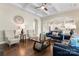 Open living room boasts hardwood floors, a coffered ceiling and lots of natural light at 10072 Fox Trotter Ln, Midland, NC 28107