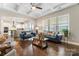 Spacious living room boasts hardwood floors, coffered ceilings, and lots of natural light from the surrounding windows at 10072 Fox Trotter Ln, Midland, NC 28107