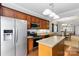 Spacious kitchen with stainless steel appliances, center island, and open layout to the dining and living areas at 1013 Laparc Ln, Indian Trail, NC 28079