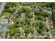 This aerial view highlights a quiet residential area with lush trees and charming homes in a desirable location at 10202 Orchard Grass Ct, Charlotte, NC 28278