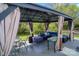 Backyard featuring a gazebo with outdoor seating, lights, and a table, creating a perfect place for relaxation at 10202 Orchard Grass Ct, Charlotte, NC 28278