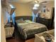 This primary bedroom has a ceiling fan and windows at 10202 Orchard Grass Ct, Charlotte, NC 28278