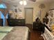 Tranquil bedroom with a ceiling fan, modern dresser, and well-organized decor at 10202 Orchard Grass Ct, Charlotte, NC 28278