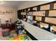 Versatile bonus room with built-in shelving, play area, and musical instruments at 10202 Orchard Grass Ct, Charlotte, NC 28278