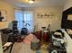 Bonus room featuring an array of musical instruments, play area, and natural light at 10202 Orchard Grass Ct, Charlotte, NC 28278