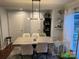 Cozy dining room with sleek modern lighting and convenient access to the outdoor space at 10202 Orchard Grass Ct, Charlotte, NC 28278
