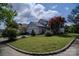 Charming home featuring manicured front lawn and a beautiful red maple tree enhancing its curb appeal at 10202 Orchard Grass Ct, Charlotte, NC 28278
