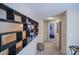 Upstairs hallway with a decorative shelf, carpet, and a view of the bedrooms at 10202 Orchard Grass Ct, Charlotte, NC 28278