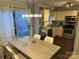 Bright kitchen and dining area with stainless steel appliances and access to the outdoor patio at 10202 Orchard Grass Ct, Charlotte, NC 28278