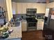 Well-equipped kitchen with stainless steel appliances, granite countertops, and lots of cabinet space at 10202 Orchard Grass Ct, Charlotte, NC 28278