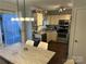 Eat in kitchen featuring stainless steel appliances, granite countertops, and modern lighting at 10202 Orchard Grass Ct, Charlotte, NC 28278
