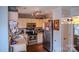 View of the kitchen including stainless steel appliances and track lighting at 10202 Orchard Grass Ct, Charlotte, NC 28278