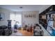 Living room featuring musical equipment, natural light, and built-in shelving, creating a versatile space at 10202 Orchard Grass Ct, Charlotte, NC 28278