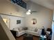 Inviting living room featuring vaulted ceilings, ample seating and a ceiling fan at 10202 Orchard Grass Ct, Charlotte, NC 28278