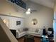 Inviting living room featuring vaulted ceilings, ample seating and a ceiling fan at 10202 Orchard Grass Ct, Charlotte, NC 28278