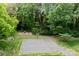 Community basketball court surrounded by lush greenery, providing a recreational space for residents at 1033 Southwest Dr, Davidson, NC 28036
