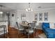Cozy dining area with a round table, stylish chairs, and hardwood floors at 1033 Southwest Dr, Davidson, NC 28036
