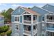 Exterior featuring multi-level balconies and architectural elements of this condo building at 1033 Southwest Dr, Davidson, NC 28036