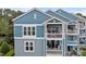 Exterior showcasing the multi-level balconies and charming architecture of this condo building at 1033 Southwest Dr, Davidson, NC 28036